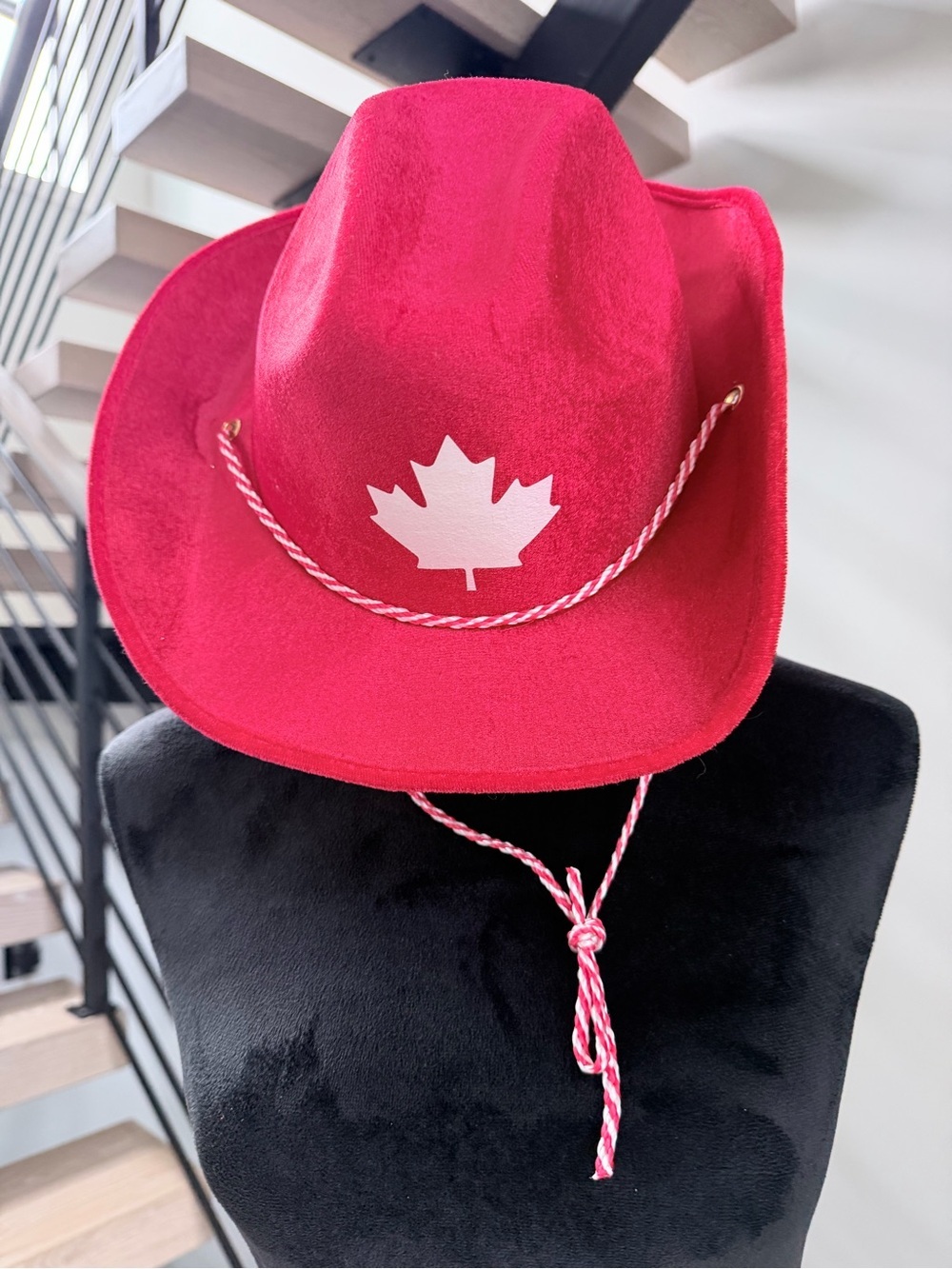 Red Felt Cowboy Hat with White Maple Leaf